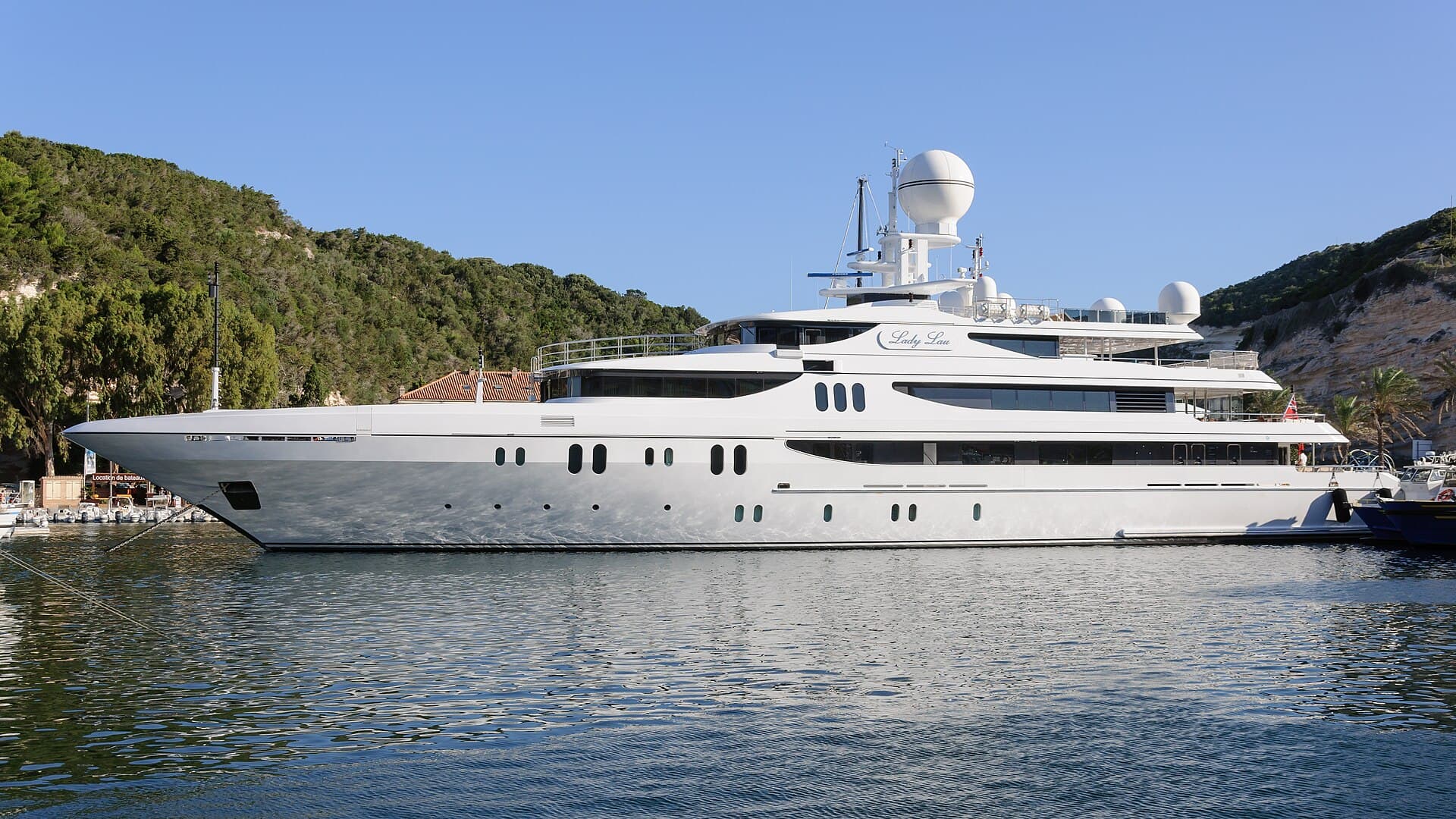 Superyacht with flawless topsides at anchor — the standard of finish yacht repair should hold